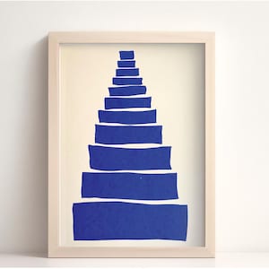 May include: A framed print of a blue abstract staircase design on a white background.
