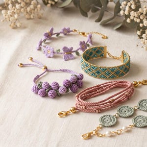 May include: Five bracelets featuring various designs: a lavender floral and butterfly motif, a teal and gold beaded cuff, a lavender berry cluster, a multi-strand dusty pink cord, and a sage green crochet circle chain with white pearls.