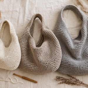 May include: A rustic wooden sign with the text "Welcome to our home" in white lettering. The sign features a distressed finish and a simple, inviting design, perfect for entryway decor.