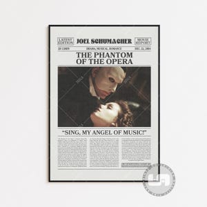 May include: A vintage-style movie poster for the film "The Phantom of the Opera" starring Joel Schumacher. The poster features a black and white image of the Phantom and Christine Daaé, with the text "Sing, My Angel of Music!" below. The poster also includes the film's release date, December 22, 2004.
