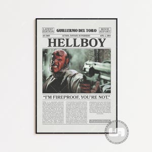 May include: A vintage-style movie poster for the film "Hellboy" directed by Guillermo del Toro. The poster features a black and white image of the character Hellboy holding a gun with the text "I'm Fireproof, You're Not." The poster also includes the movie's release date, April 2, 2004.