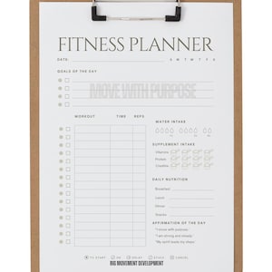 May include: A fitness planner on a clipboard with a brown wooden backing. The white paper has sections for goals, workouts, water intake, and daily nutrition. Text includes "FITNESS PLANNER" and "MOVE WITH PURPOSE."