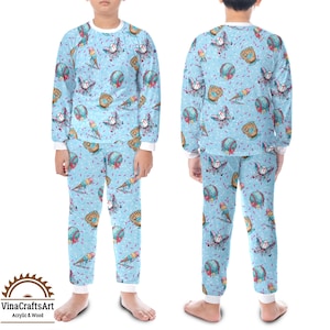 May include: Light blue children's pyjama set featuring a pattern of baseballs, gloves, and ice cream cones. The top and trousers have white trim. The pyjamas are designed for children.