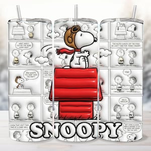 May include: A stainless steel tumbler featuring a comic strip design with Snoopy in a pilot's hat on his red doghouse. The tumbler includes the word "SNOOPY" in bold letters and a clear straw. The design is black, white, and red.