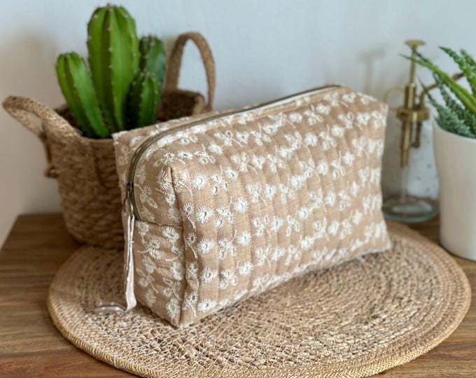 Beige embroidered toiletry bag