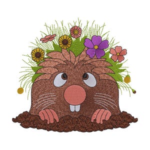 May include: An embroidered design of a brown mole emerging from a mound of dark brown soil. The mole has a pink nose, two white teeth, and large eyes looking upward. Green grass and colorful flowers in yellow, pink, and purple surround its head.