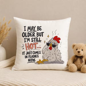 Decorative pillow featuring a funny chicken embroidery design with hot flashes quote, machine embroidery file for farmhouse home decor, pillow covers and chicken lover projects.