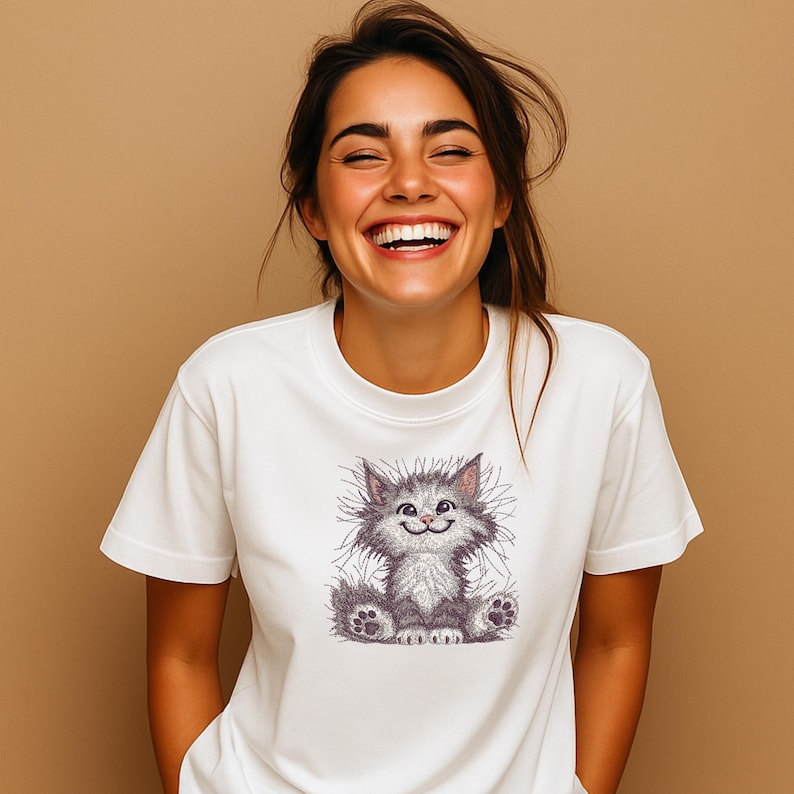 Laughing woman in white t-shirt featuring cute fluffy cat embroidery design, great for baby gifts, DIY shirts, and pet lover projects.