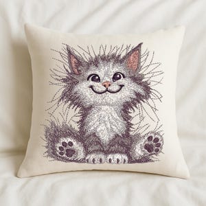 Cream pillow with fluffy cat embroidery design, ideal for nursery decor, kids' rooms, and cozy handmade home accents for pet lovers.