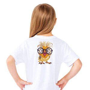 Back view of a girl wearing white t-shirt with cute owl embroidery design featuring glasses – perfect for children’s clothing, back-to-school outfits, or birthday gifts in the USA and Europe.