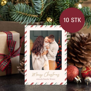 May include: Christmas card featuring a family portrait with the text "Merry Christmas" and "w&uuml;nscht Familie Winter". The card has a cream background with red and green striped borders. A red circle with "10 STK" is in the upper right corner.