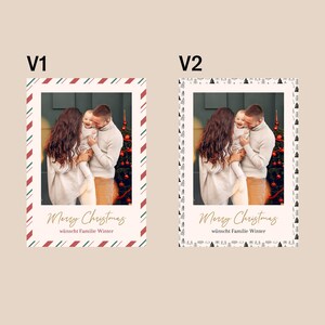 May include: Christmas card featuring a family of three, with the text "Merry Christmas" in gold script. The card has a cream background with a red, green, and white striped border. The family is embracing in front of a Christmas tree.