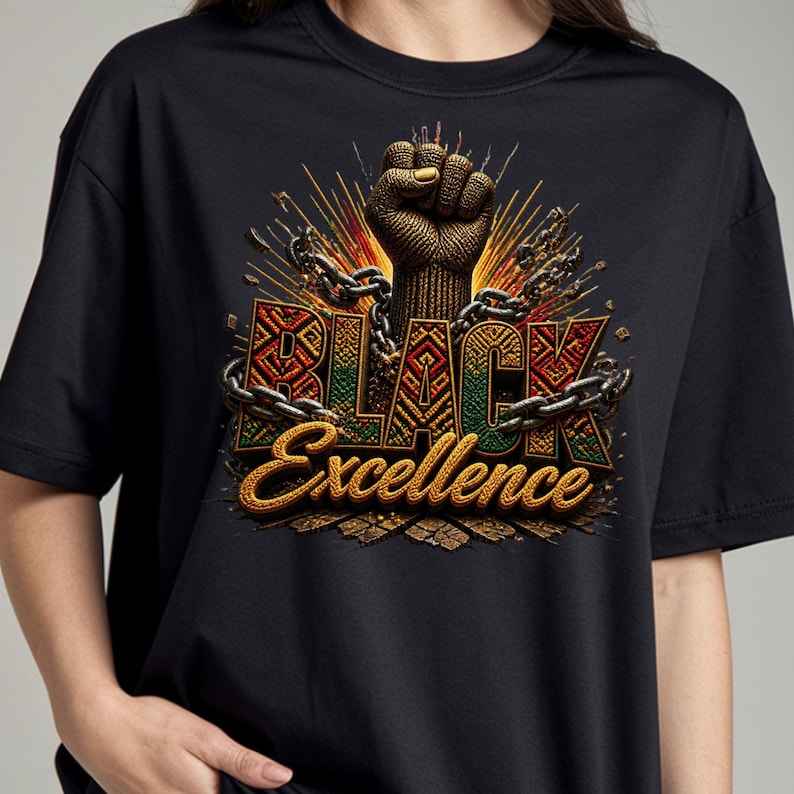 May include: Black t-shirt featuring a raised fist graphic with the words "BLACK Excellence". The design incorporates chains and a color scheme of gold, red, green, and black. The shirt is made of a soft material.