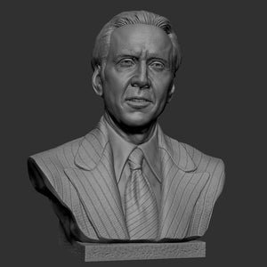 Pode incluir: Busto em tons de cinza de um homem de terno e gravata. A escultura é detalhada, mostrando os traços faciais do homem e as riscas finas no terno. O busto é montado em uma base retangular.