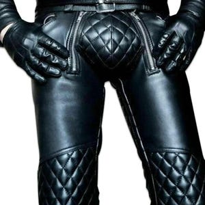 May include: Black leather trousers with a quilted design and zipper details.