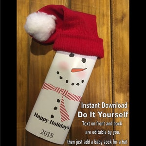 May include: A printable snowman craft template with a red hat and a white pom-pom. The template includes the text "Happy Holidays 2018". The text "Instant Download Do It Yourself Text on front and back are editable by you. then just add a baby sock for a hat" is also included.