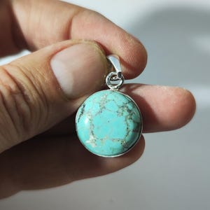 Turquoise pendant in silver