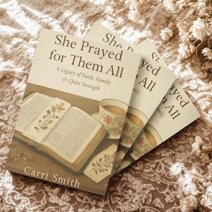 May include: Three copies of a book titled "She Prayed for Them All" are displayed, with an open book and teacups visible. The book cover features text and illustrations of flowers and a teacup. The author's name, Carri Smith, is also visible.