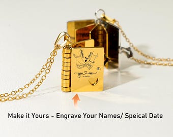 May include: A gold-colored locket necklace with a chain. The locket is shaped like a small book, with engraved hands and the words "you & me" and a date. The text "Make it Yours - Engrave Your Names/ Speical Date" is at the bottom.