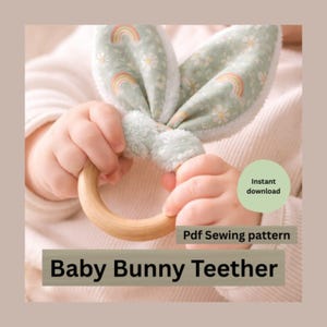 May include: A baby bunny teether with a wooden ring and soft, patterned bunny ears. The ears are light green with a floral and rainbow design. The text "Baby Bunny Teether" and "Pdf Sewing pattern" are visible.