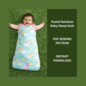 May include: A baby wearing a pastel blue sleep sack with a rainbow and cloud pattern. The sleep sack has pink trim and is labeled "Pastel Rainbow Baby Sleep Sack." The image also includes the text "PDF Sewing Pattern" and "Instant Download."