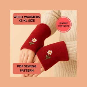 May include: Red wrist warmers with embroidered white daisy and green stem detail. The image text reads "Wrist Warmers XS-XL Size", "Instant Download", and "PDF Sewing Pattern".
