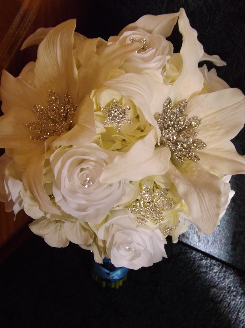 Starburst snowflake crystal brooch bouquet roses and real touch Casablanca lilies creamwhite hydrangea