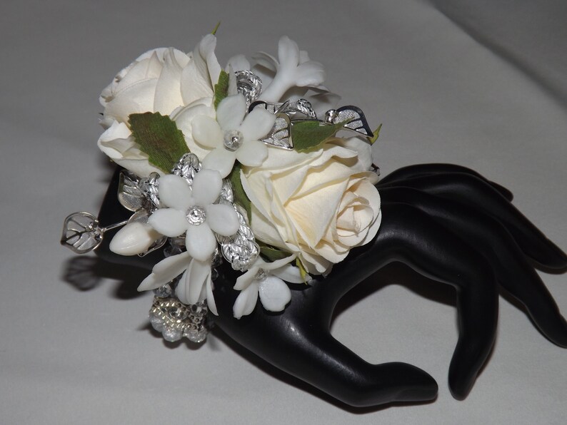 jeweled stephanotis wristlet wedding silver leaf accents prom special event Silver sparkle wrist corsage with cream white petite roses