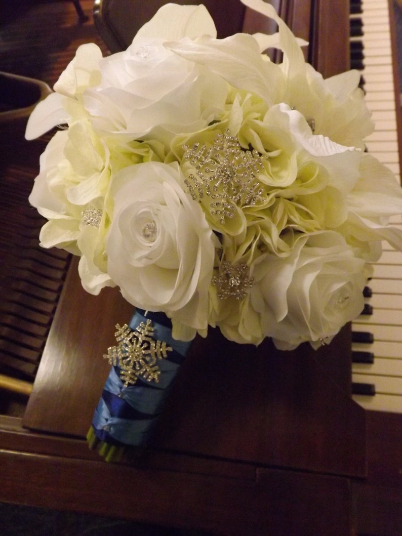 Starburst snowflake crystal brooch bouquet roses and real touch Casablanca lilies creamwhite hydrangea
