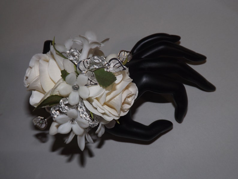 jeweled stephanotis wristlet wedding silver leaf accents prom special event Silver sparkle wrist corsage with cream white petite roses