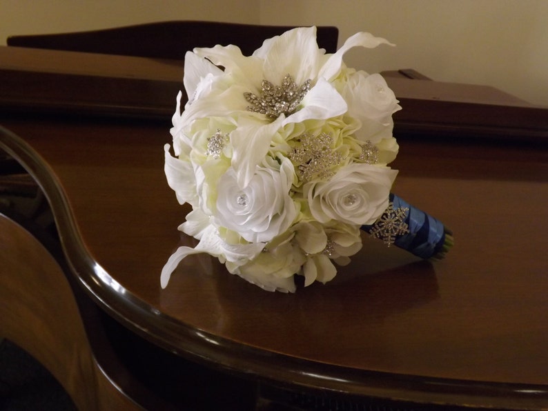 Starburst snowflake crystal brooch bouquet roses and real touch Casablanca lilies creamwhite hydrangea