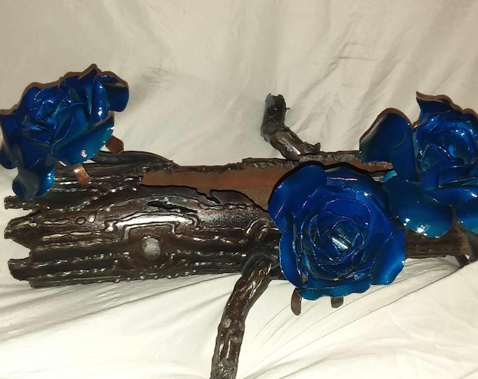 Featured listing image: Hand created sculpture out of steel. Made  to mimic a natural log with raised  woodgrain bark  in rust patina  finished with candy roses