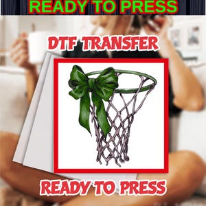 May include: DTF transfer design featuring a basketball net with a green bow. The design is framed in red and includes the text "READY TO PRESS" in green and red. Ideal for creating custom apparel.