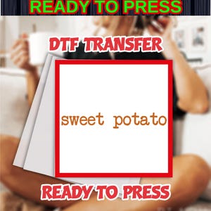 May include: A DTF transfer sheet with the words "sweet potato" in brown, framed in red. The words "READY TO PRESS" are in green at the top and bottom. The background is blurred.