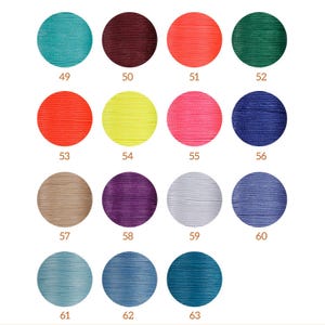 May include: A color chart with 15 different colored thread samples. The colors include teal, maroon, coral, forest green, orange, yellow, pink, navy blue, beige, purple, gray, light blue, blue, and teal.