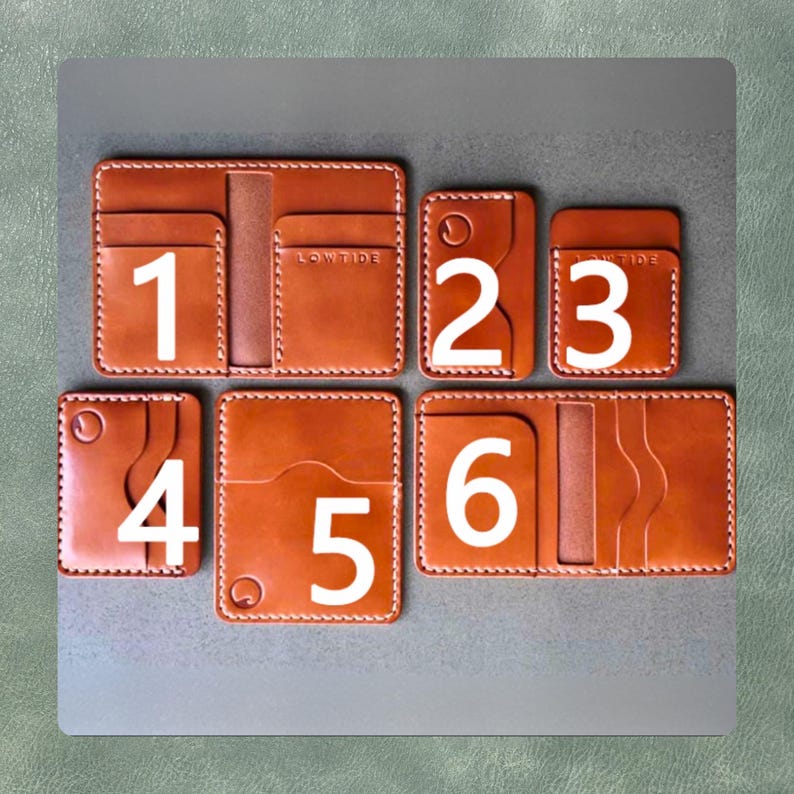 May include: A collection of six brown leather wallets with white stitching and white numbers. The wallets vary in size and design, some with card slots and the word "LOWTIDE" embossed on them. The background is a neutral gray.