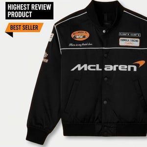 May include: Black McLaren Formula 1 racing jacket with white accents and patches. Features the McLaren logo in white and orange, and the text "Here is me firetch love." Includes the text "HIGHEST REVIEW PRODUCT" and "BEST SELLER".