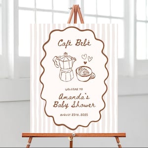 May include: A baby shower welcome sign on a wooden easel. The sign features a brown border with the words "Café Bébé" at the top, and a coffee pot and cup illustration. Below, it reads "Welcome to Amanda's Baby Shower, August 25th, 2025."
