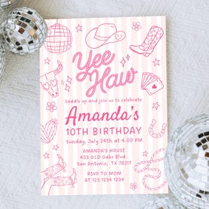 May include: Pink and white striped birthday invitation with a cowgirl theme. The invitation features the words "Yee Haw" in a cursive font, along with illustrations of a cowboy hat, boots, and playing cards. The invitation is for Amanda's 10th birthday.