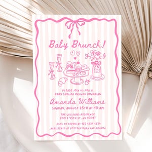 May include: Pink and white striped invitation for a baby shower brunch. The invitation features a pink border and illustrations of brunch items, including champagne flutes, pastries, and flowers. Text reads "Baby Brunch!" and details for the event.