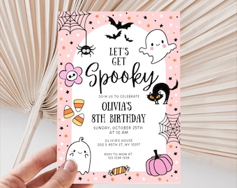 May include: Pink Halloween-themed birthday invitation with the text "Let's Get Spooky." Features include a spiderweb, bats, ghosts, a black cat, a pumpkin, and candy corn. The invitation is for Olivia's 8th birthday.