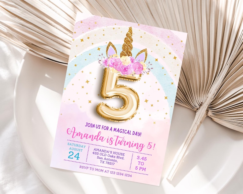 May include: A birthday invitation with a unicorn theme. The invitation features a gold number 5 balloon, a unicorn horn, and floral accents. The text reads "Amanda is turning 5!" and includes event details.