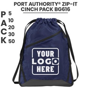 May include: Navy blue cinch pack with black accents and a zippered pocket. The bag features the text "YOUR LOGO HERE" in a white rectangle. The top of the bag has a drawstring closure. The text "PORT AUTHORITY ZIP-IT CINCH PACK BG616" is at the top.