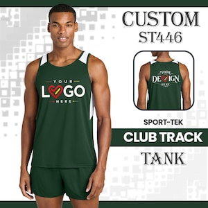 May include: A dark green Sport-Tek club track tank top and matching shorts. The tank features white side panels and a graphic on the chest that reads YOUR LOGO HERE with a heart icon. A smaller inset shows the back of the tank with the same design.