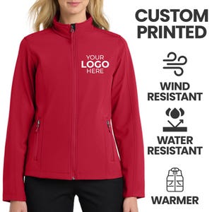 May include: A red softshell jacket with a full zipper, two front pockets, and a mock neck collar. The jacket features the text "YOUR LOGO HERE" and is labeled as wind and water resistant. The image also states "CUSTOM PRINTED" and "WARMER".