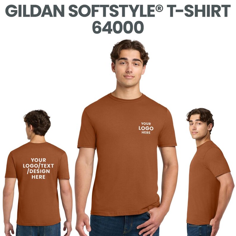 May include: A rust-coloured Gildan Softstyle T-shirt, style 64000, with the text "YOUR LOGO HERE" printed on the front and "YOUR LOGO/TEXT/DESIGN HERE" on the back. The shirt is displayed from multiple angles.