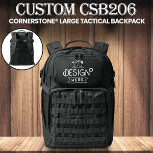 May include: Black Cornerstone large tactical backpack with multiple compartments and MOLLE webbing. Features a front pocket with the text "YOUR DESIGN HERE" in white. Includes a circular inset showing the back of the backpack.