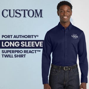 May include: Navy blue long-sleeve twill shirt with the text "YOUR LOGO HERE" on the chest. The shirt is part of the Port Authority SuperPro React collection. The word "CUSTOM" is at the top of the image.