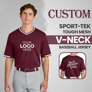 May include: A maroon V-neck baseball jersey with white trim on the collar and sleeves. The jersey has the text "YOUR LOGO HERE" on the front. The image also shows the text "CUSTOM SPORT-TEK TOUGH MESH V-NECK BASEBALL JERSEY".