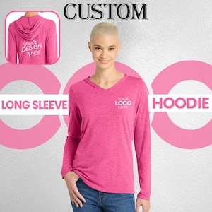 May include: A magenta long-sleeve hoodie with a V-neck, featuring the text "YOUR LOGO HERE" on the chest. The back of the hoodie is visible in a small inset, with the text "Your Design Here". The word "CUSTOM" is at the top.